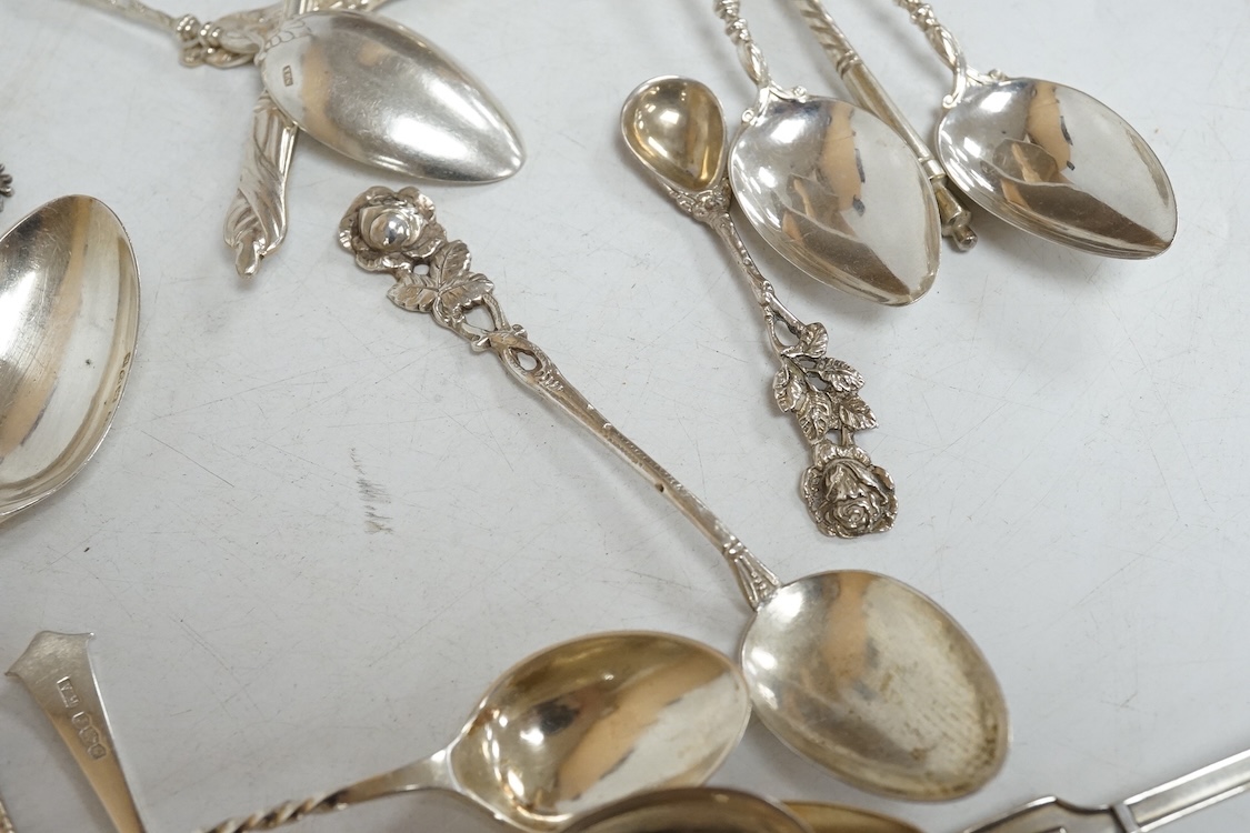 A group of assorted silver and white metal tea and coffee spoons and a pair of silver sugar tongs, weighable hallmarked silver 8.6oz.